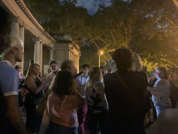 community members crowd CM Stephen Levin at an outdoor meeting