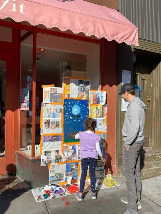 children paint windows in cobble hill
