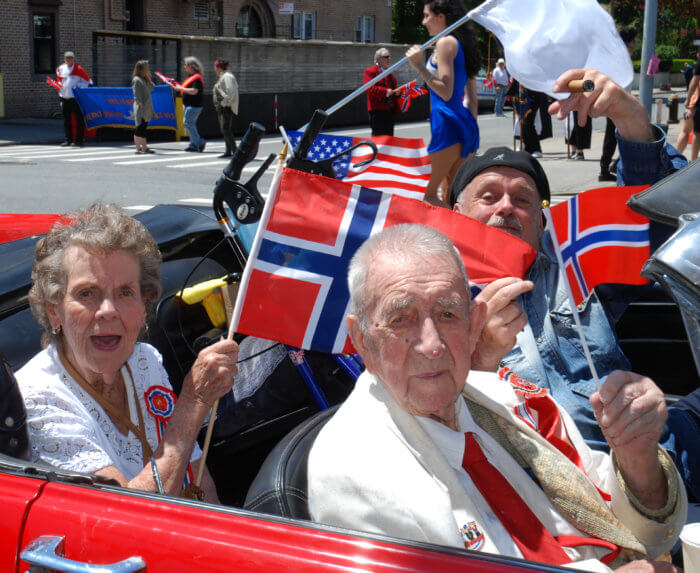 norwegian day parade people in car with flags
