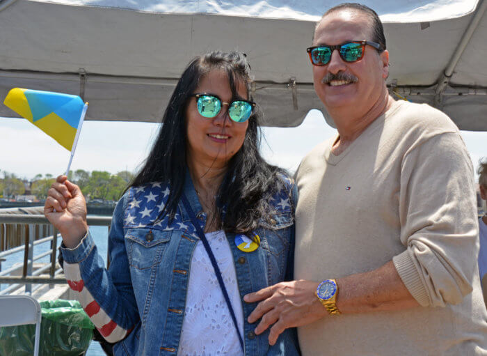 woman and man wave ukrainian flag at bayfest