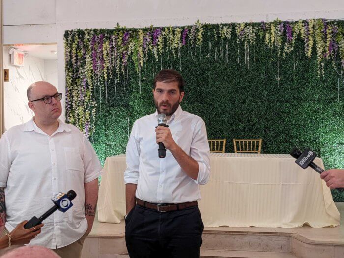 andrew gournades and justin brannan at press conference with victims of fraud