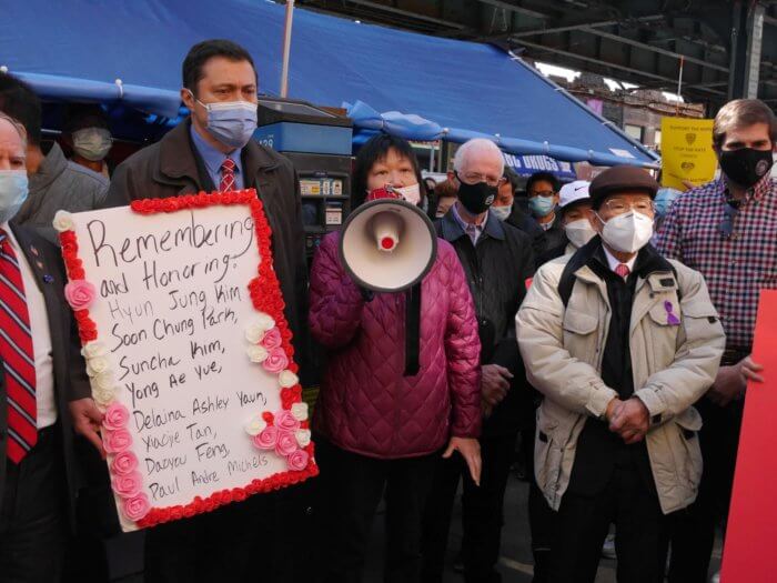 councilmemer ari kagan holding sign at rally