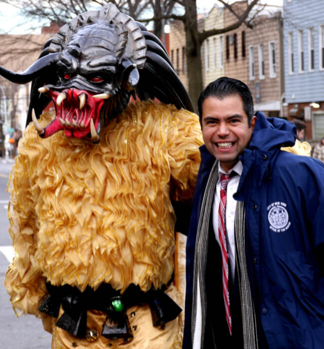 man with person in costume at three kings day parade