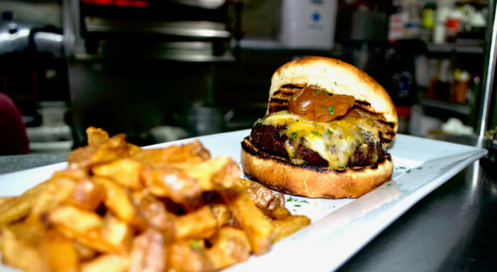 Burger and fries served at the Flatiron Steakhouse in Park Slope.