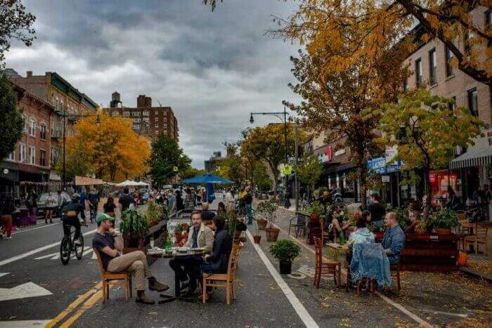 people sitting on vanderbilt avenue open street