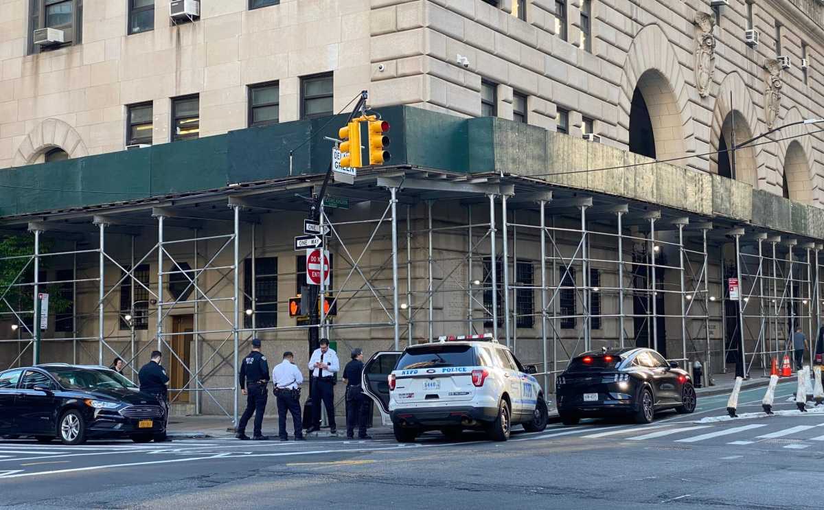 Cops patrol outside Brooklyn Central Booking on Schermerhorn Street between Smith Street and Boerum Place.