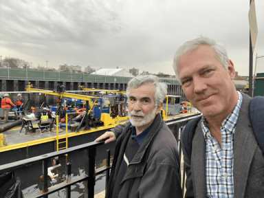 man christos tsiamis standing next to gowanus canal