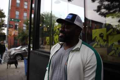 man outside his store in North Brooklyn