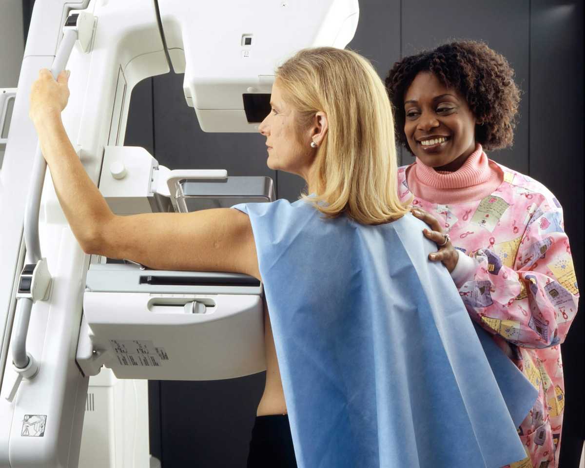 woman getting mammogram