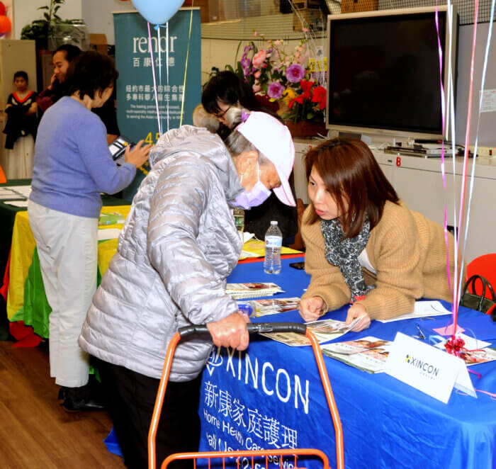 woman standing at table at health fair