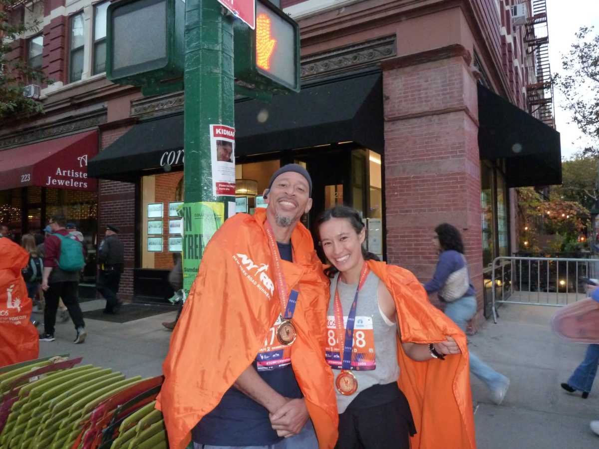 marathon runners on street with team inspire