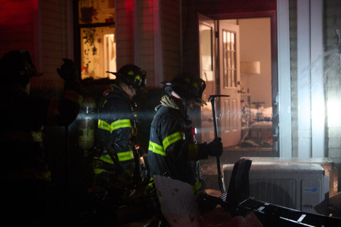 firefighters outside apartment fire