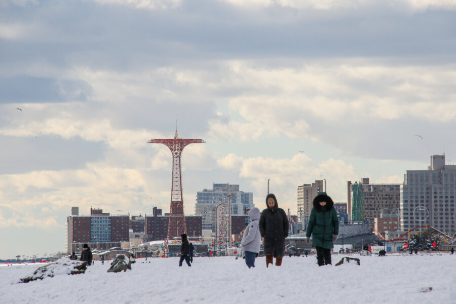 people on snowy beach in Brooklyn in February