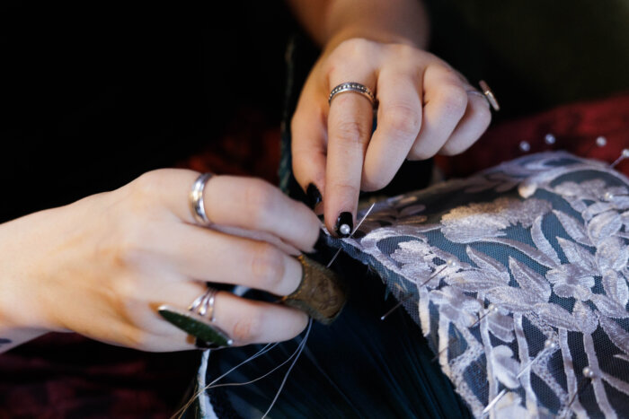 close up of woman working on handmade lampshade