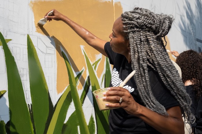 painter working on mural