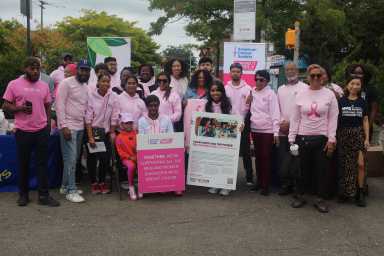 breast cancer awareness ribbon-tying