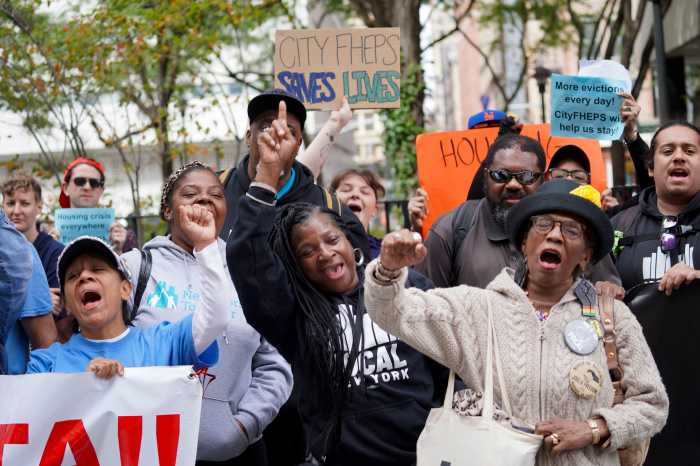 group of people at cityFHEPS expansion rally with signs