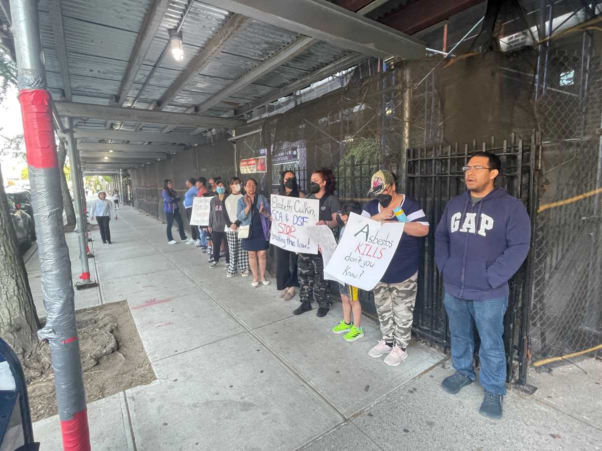 parents stand outside p.s. 176 protesting asbestos issues