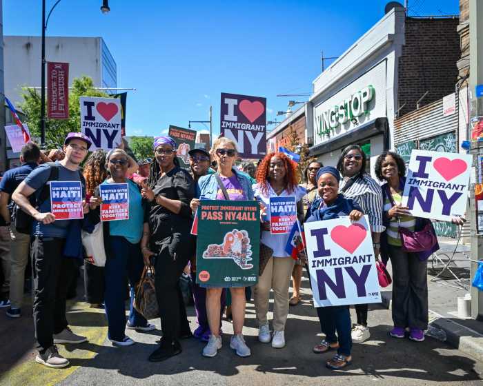 group of people rally for haitian immigrants
